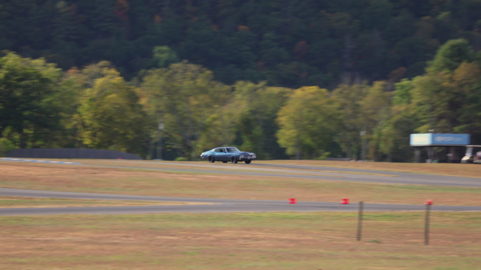 Watch a pro touring muscle car race on track, showcasing advanced muscle car suspension systems engineered for high performance and superior handling. Experience precision suspension tuning that elevates track performance for muscle cars.